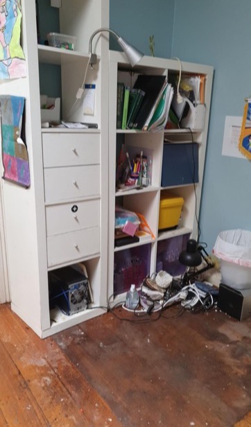 Water-damaged timber floor in study before drying — real drySafe job